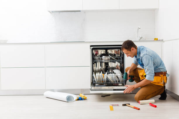 istock Handsome professional plumber doing sink reparation. Contractor. 1186965053