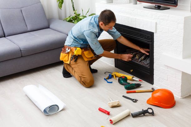 Finishing the fireplace. Putting plaster. Finishing the fireplace. Putting plaster. fireplace stock pictures, royalty-free photos & images