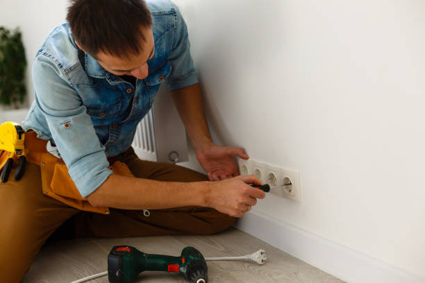 electrician checking socket voltage with digital multimeter - art installation imagens e fotografias de stock