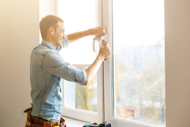 istock Close-up of a handyman fixing window frame 1186967236