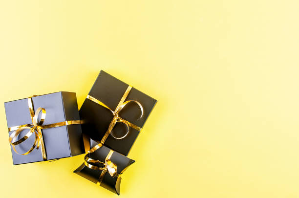 istock Christmas or New Year background. Christmas tree and black gift box 1186967906