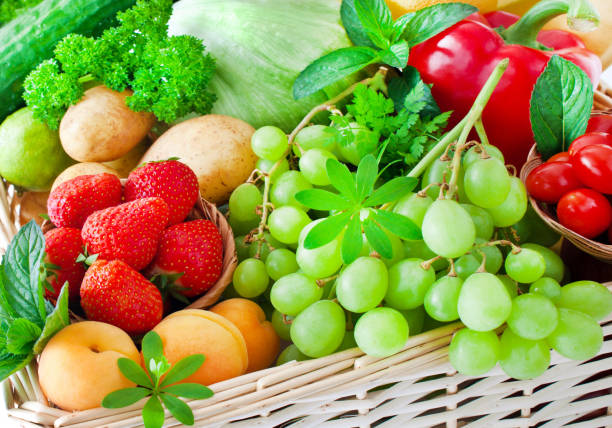 istock Various fruits and vegetables in a basket 1186968811