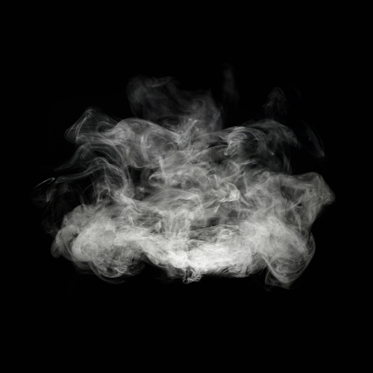 Fragrance cloud from an aromatherapy diffuser isolated on black.