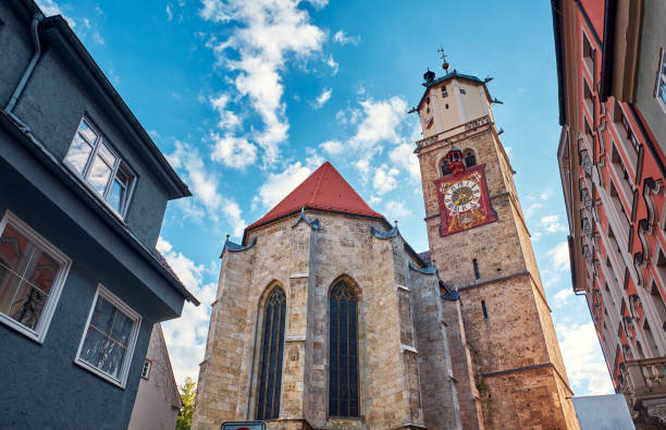 St. Martin church with the clock in the old city in Memmingen. stock photo