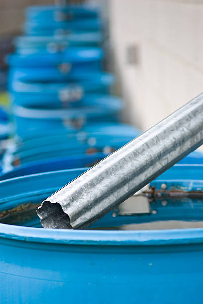 istock Blue rain barrels in a row flowing into each other 118697159