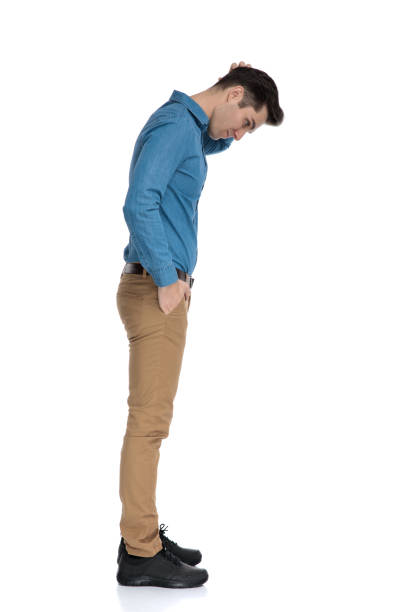 istock young smart casual man looking down and scratching head 1186972360