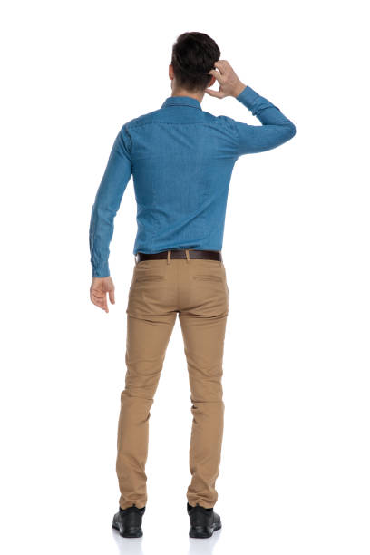 istock back view of young man scratching head and thinking 1186972392