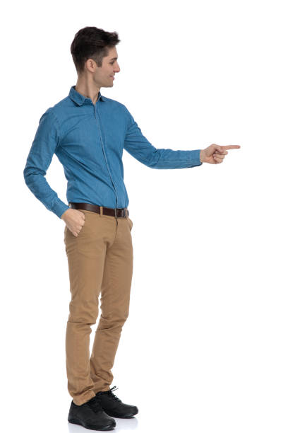 istock side view of smart casual man smiling and pointing finger 1186972631