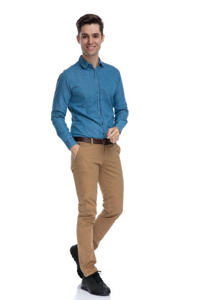 istock smart casual man holding hand in pocket and smiling 1186973422