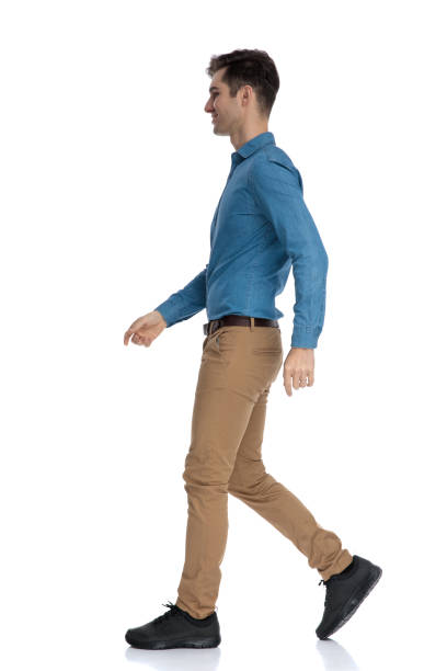 istock side view of smart casual man walking and smiling 1186973760