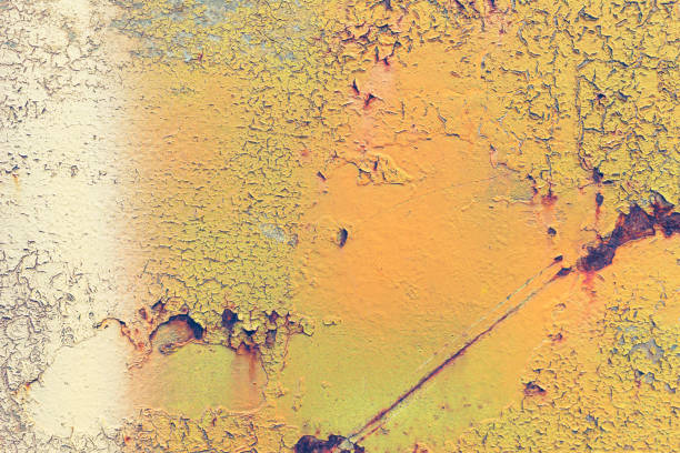 istock Rusty yellow metal texture background. Wall banner, material, rust or construction. Steel wall with pattern for design, rusty metal plate 1186973858