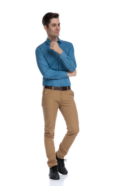 istock happy smart casual man looking to side and walking 1186973926