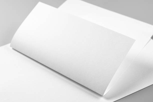 istock Blank Folded Letterhead or Flyer over Stack of Letterheads 1186974688