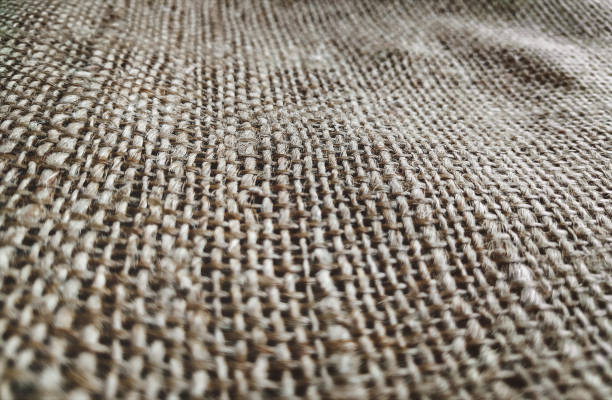 istock Old dirty beige burlap texture. Close up, copy space, grunge fabric background. 1186974784