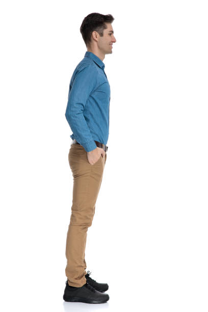 istock happy young man waiting in line and smiling 1186974794