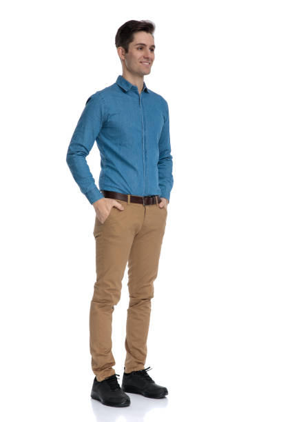 istock happy smart casual model holding hands in pockets 1186974850