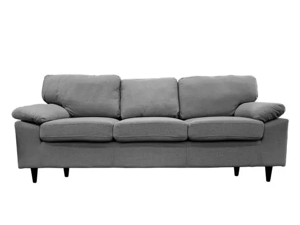 Front view of a fabric modern grey sofa isolated on a white background.