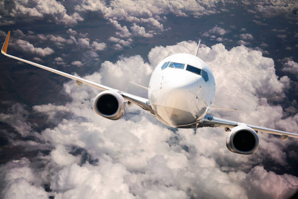 istock Commercial airplane flying above clouds 1186975294
