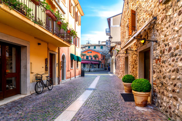 Narrow street in the old town of Bardolino on a sunny day in autumn stock photo