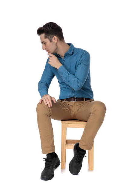 istock smart casual man touching chin and thinking 1186975777