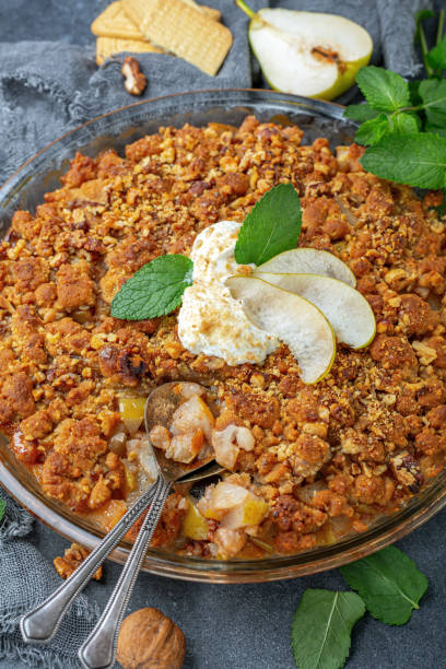 istock Summer pear pie with crumbs and walnuts. 1186978521
