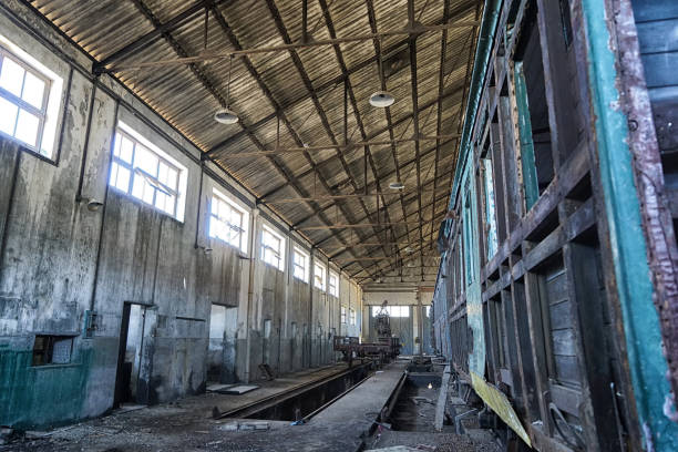 istock An old railroad facility with partially rotted railroad wagons 1186980074
