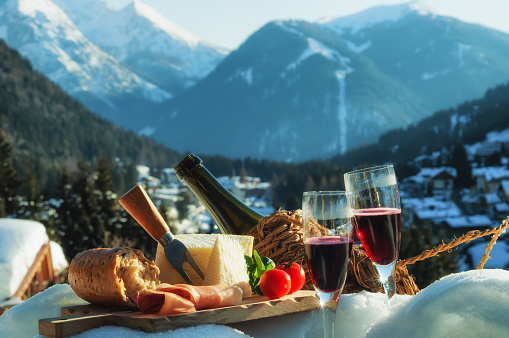 Outdoor winter picnic in italian countryside with mountains view