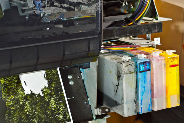 istock The printer is disassembled into parts. Broken, dirty and dusty printer. Service center for equipment repair. Refilling with ink and cleaning of printing equipment. 1186985986
