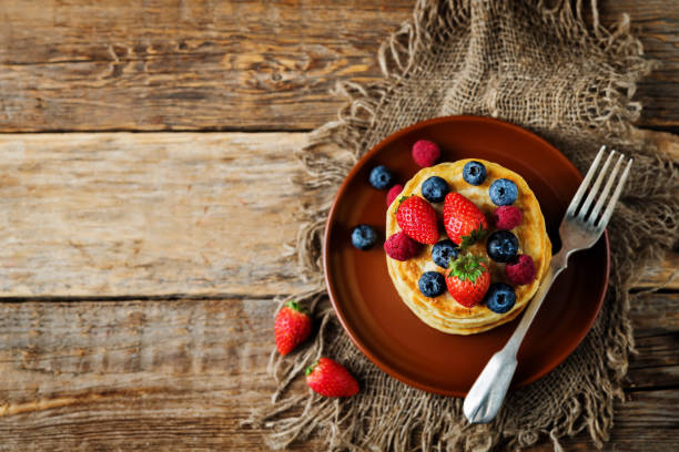 istock pancakes with strawberries, blueberries and raspberries 1186986904