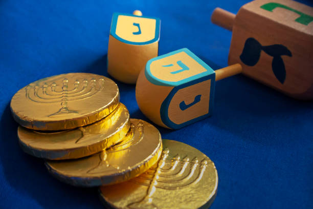 jewish holiday hanukkah with wooden dreidel and chocolate coins - chocolate coins imagens e fotografias de stock