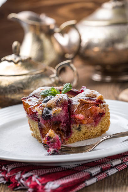 istock Yeast cake with plums and blueberries. 1186989436