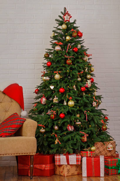 istock Christmas tree and gifts 1186989843