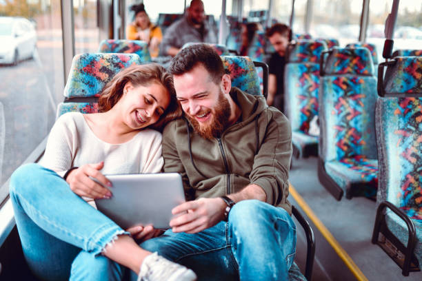 istock Cute Couple Riding Together On A Bus 1186990565