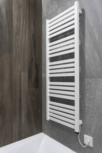 istock White and modern heated towel rail in bathroom 1186990810