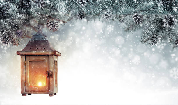 istock Christmas background with spruce branches and wooden lantern. 1186994872
