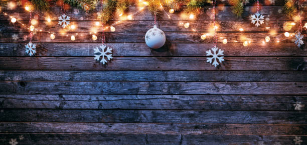 istock Christmas background with wooden decorations and spot lights. 1186994900