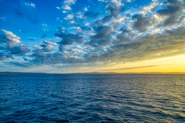 a vibrant sunrise/sunset over the ocean
