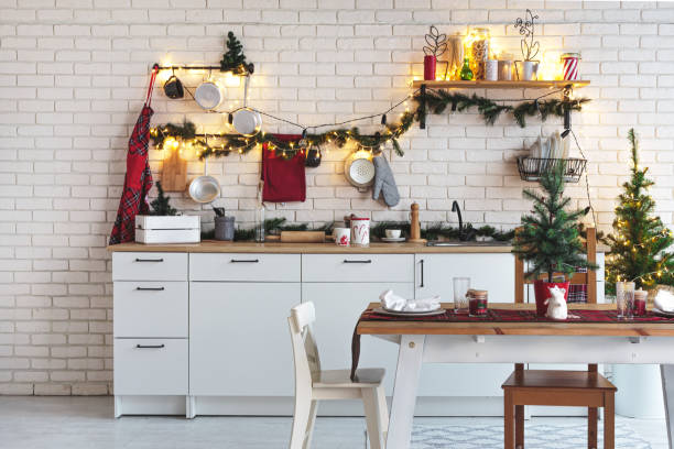 istock Interior white kitchen with lights and red christmas decorations 1186996263