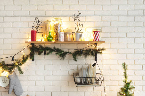 istock Interior white kitchen with lights and red christmas decorations 1186996267
