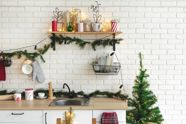 istock Interior white kitchen with lights and red christmas decorations 1186996269
