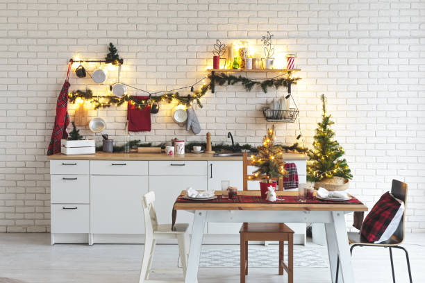 istock Interior white kitchen with lights and red christmas decorations 1186996270