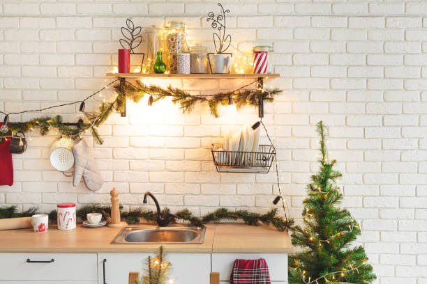 istock Interior white kitchen with lights and red christmas decorations 1186996284