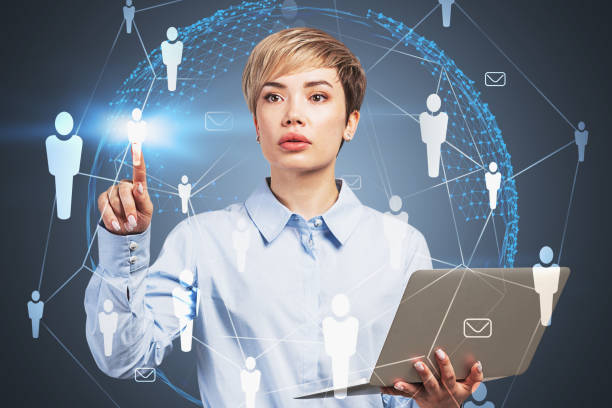 istock Woman with laptop working with HR icons 1186996729