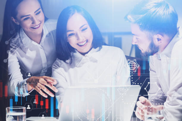 istock Happy young business people in office, graphs 1186996769