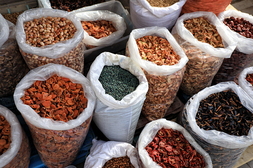 close up sacks of dried foods, herbs and cereals in farmer's market stall in Konya, Turkey