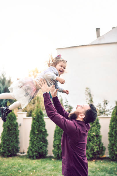 istock Young Father Playing With Toddler Daughter 1186997664