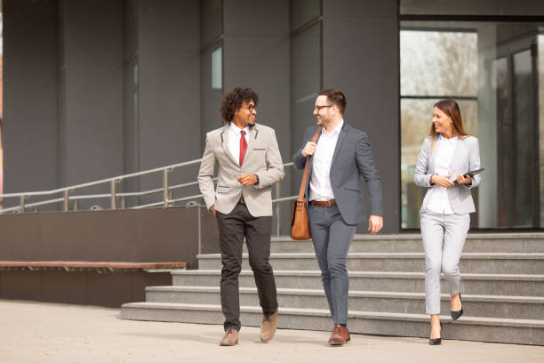 istock A manager and his secretary escorting a business partner on a visit. 1187000892