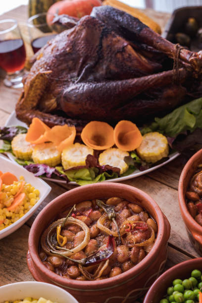 istock Thanksgiving dining, roast turkey with side dishes on table 1187003374