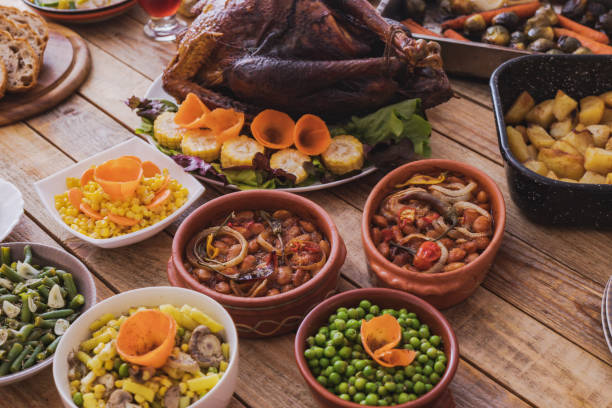 istock Thanksgiving dining, roast turkey with side dishes on table 1187003552