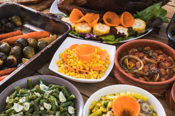 istock Thanksgiving dining, roast turkey with side dishes on table 1187003575